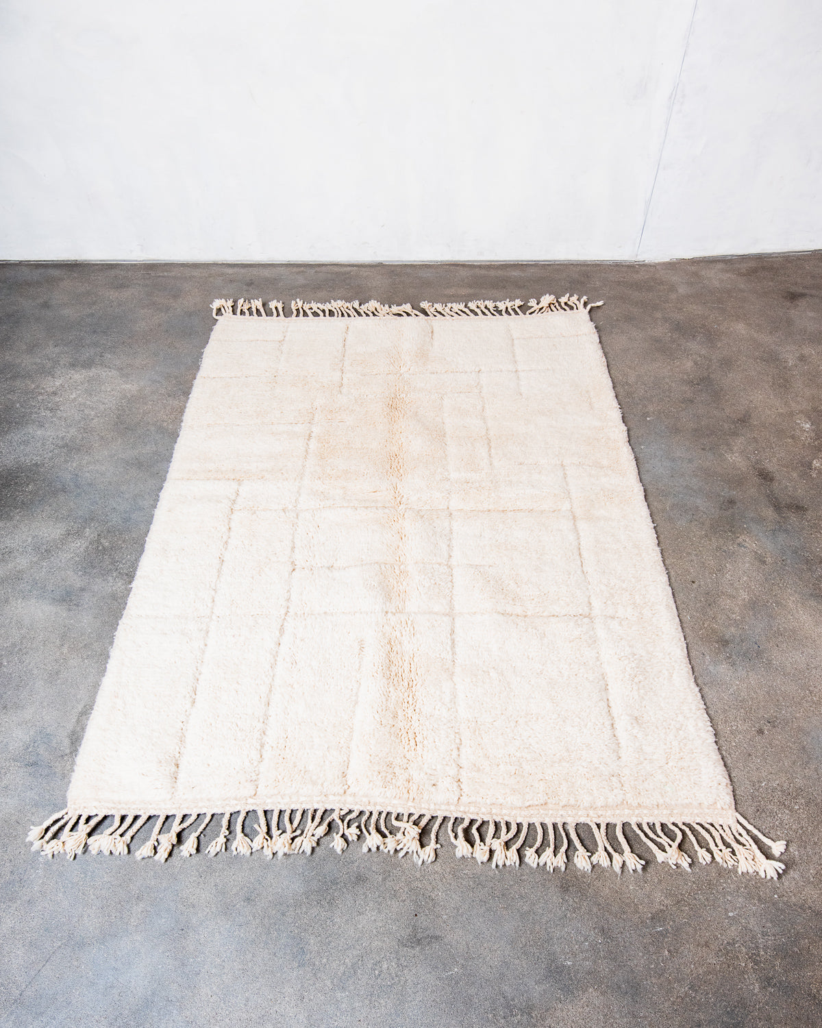 Modern, designer, handcrafted Berber rug from Morocco. Beniourain carpet with minimalist design, natural wool pile and a fluffy texture.